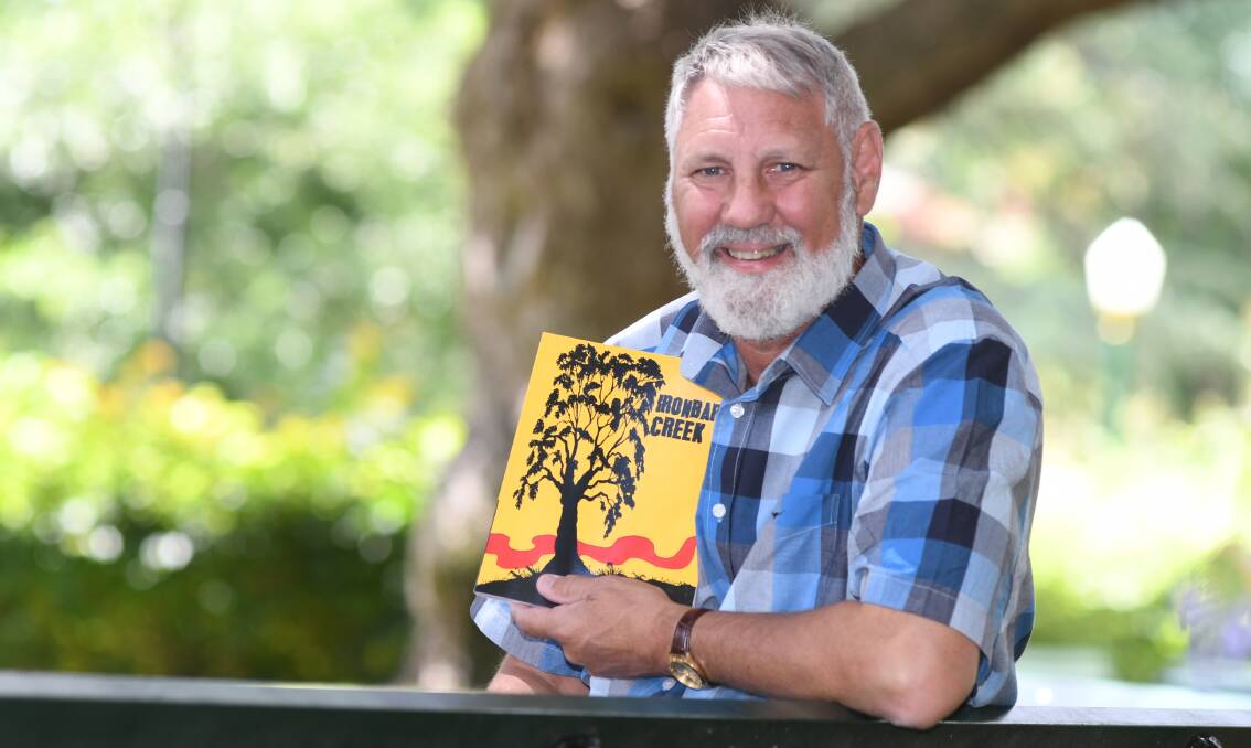 FLIPPING THE NARRATIVE: Bathurst author and academic David Stanley with his debut novel, 'Ironbark Creek'. Photo: CHRIS SEABROOK
