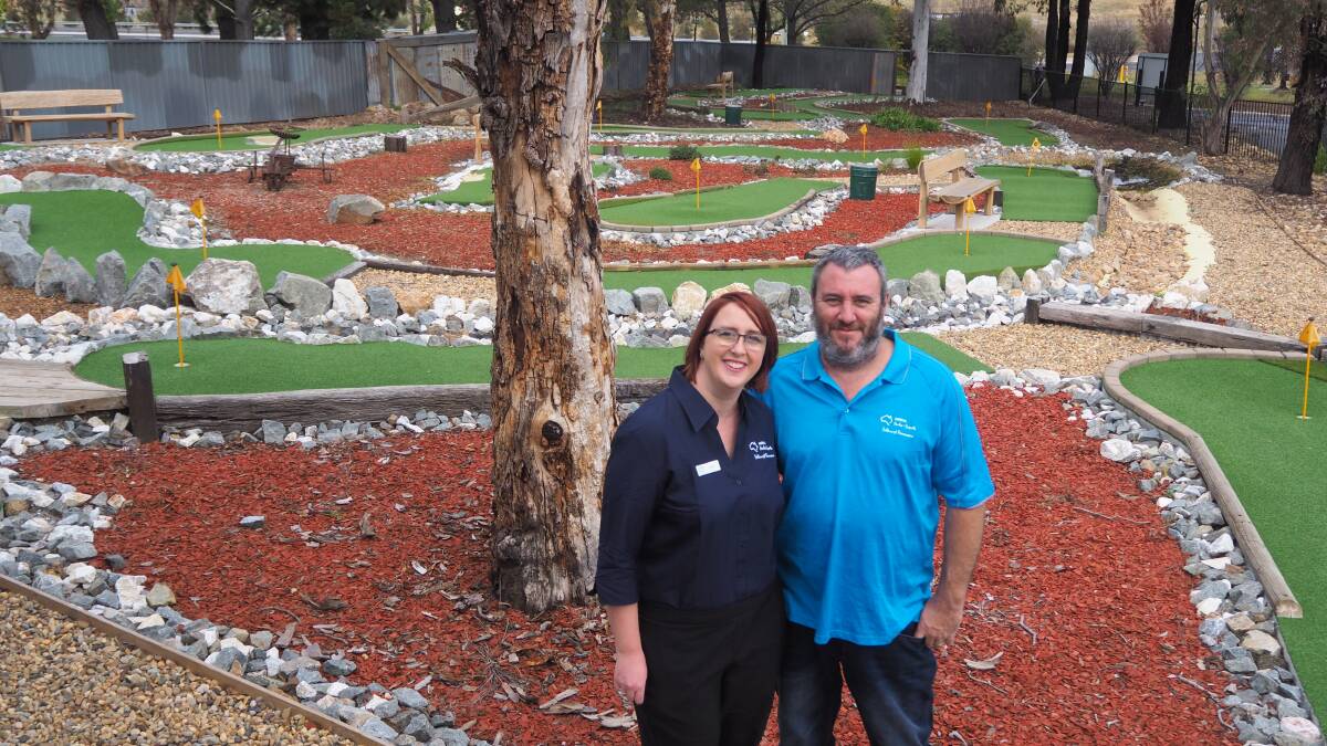 READY FOR GUESTS: NRMA Bathurst Panorama Holiday Park managers Lauren and Baden Shipley at the site's mini golf course. Photo: SAM BOLT