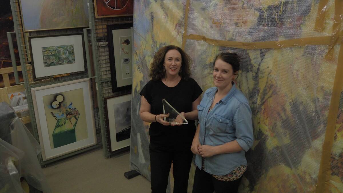 ACHIEVEMENT: Bathurst Regional Art Gallery [BRAG] director Sarah Gurich and acting collections manager Kate Bywater with their IMAGinE award. Photo: SAM BOLT
