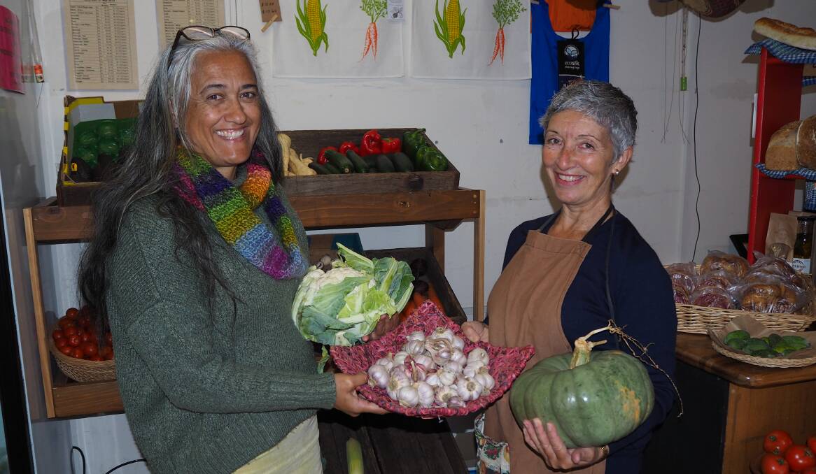 SEASONAL PRODUCE: Bathurst Wholefood Co-operative's Kiri Armstrong and Belinda Garrood with some fresh vegetables. Photo: SAM BOLT