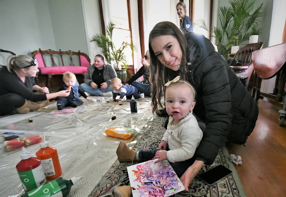 McKenzie Barwick with her one-year-old daughter, Zaylee at the Paint and Puree class on Wednesday. Photo:CHRIS SEABROOK