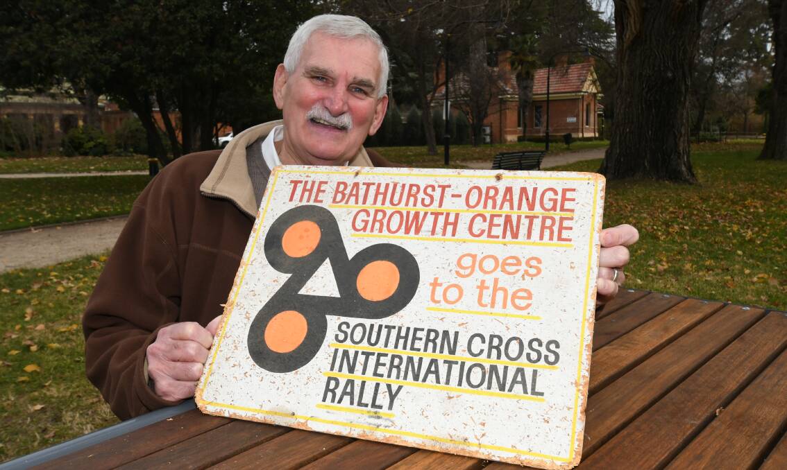 JOURNEYED: Living Legend Arthur Davis with a historic sign promoting the 1970s Bathurst-Orange Growth Centre project. Photo: CHRIS SEABROOK