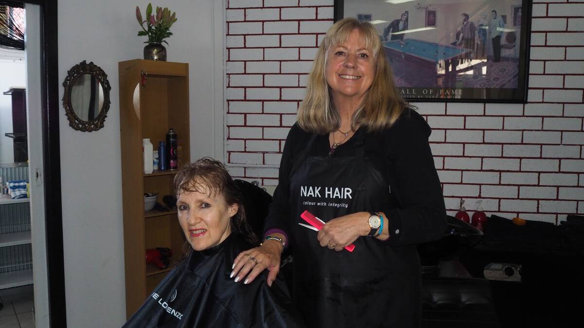 STYLISH APPROACH TO HAIRDREESING: Can Do Cuts manager Jenny Gleeson [right] with Joe Dowling. Photo: SAM BOLT