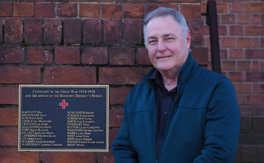 FAMOUS NAMES: Historian Andrew Fletcher with the Carillon plaque commemorating 24 Bathurst nurses who served during World War I. Photo: SAM BOLT
