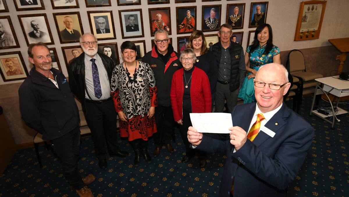 ASSISTANCE: Mayor Graeme Hanger with representatives from some of the recipient organisations who received Section 356 Donations at the Bathurst Council Chambers yesterday. Photo: CHRIS SEABROOK 082119cfundng