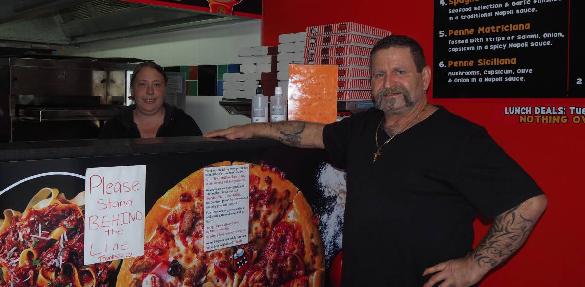FULL OF CHARACTER: Vic's Fat Pizza manager Rhonda Davis and owner Vic Issa at their Stewart Street store. Photo: SAM BOLT