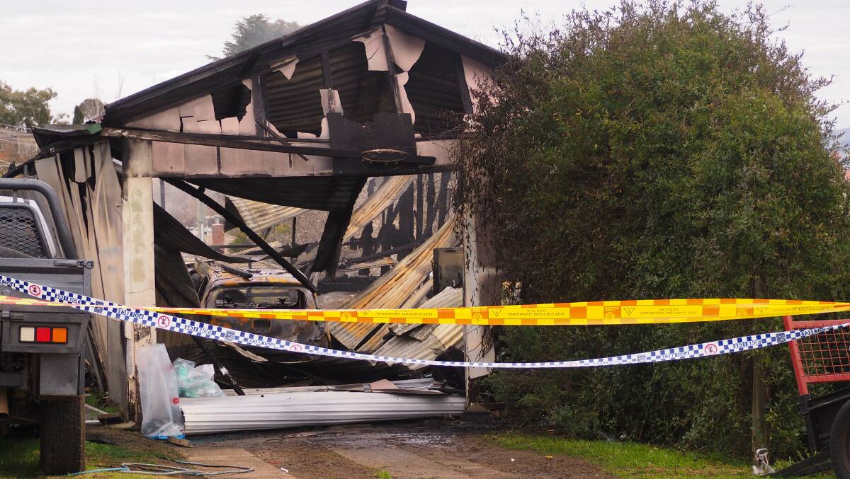 EXTENSIVE DAMAGE: The scene at a Moresby Way property on Friday morning after a blaze razed through the property's shed overnight. Photo: SAM BOLT