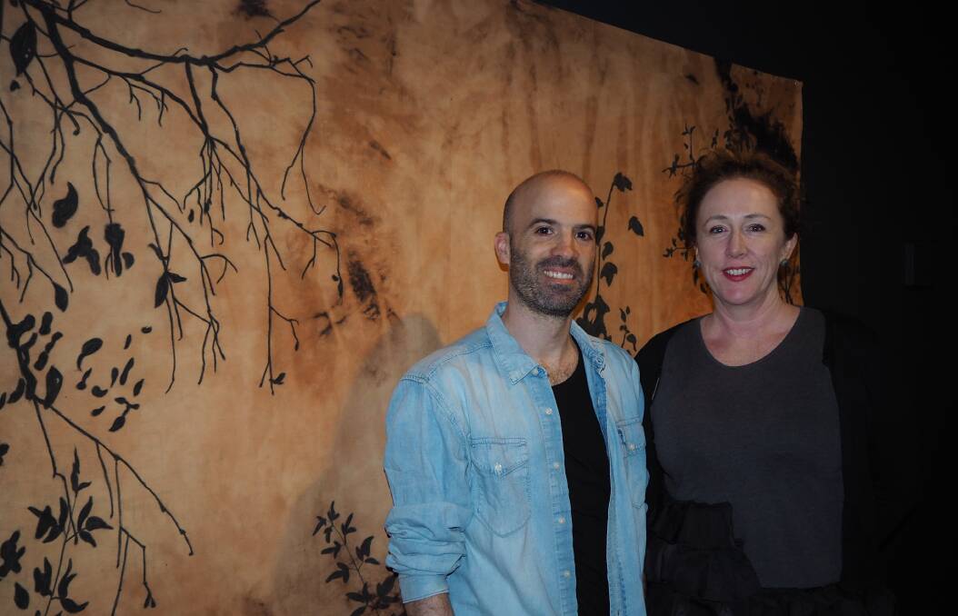 SENSORY LANDSCAPE: French artist Fabrice Cazenave and Bathurst Regional Art Gallery director Sarah Gurich with a work from Cazenave's new exhibition 'The Garden of Shadows.' Photo: SAM BOLT 041019sbfabr1