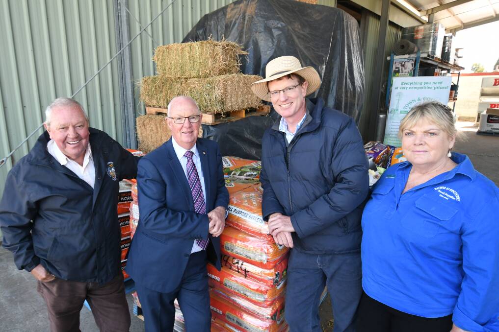 DROUGHT AID: Lithgow mayor Ray Thompson, Bathurst mayor Graeme Hanger, Calare MP Andrew Gee and Town and Country Rural Supplies owner Vicki Wilson.  Photo: CHRIS SEABROOK  032619cmoney1