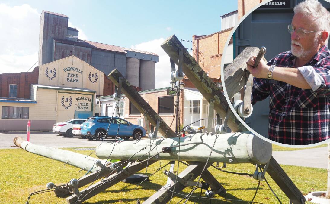 PROGRESS: Tremain's Mill owner Stephen Birrell [inset] said the removal of condemned telegraph poles [pictured] from the precinct is part of the site's move to a self-sustaining solar energy system. Photos: SAM BOLT