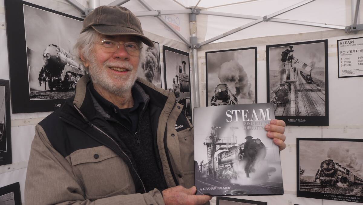 Graham Palmer with a selection of his steam train photography from the 1960s. Photo: SAM BOLT