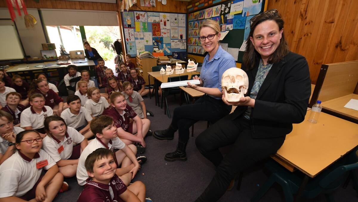 BRAIN FOOD CAREERS: Dr Ronika Power and Dr Kate Grarock talking to students at Bathurst West Public School on Monday. Photo:CHRIS SEABROOK