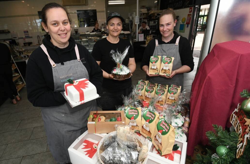 TREATS: Bakehouse on the Boulevard's Lauren Mason, Heather Parish and Carissa Mason with some of the store's Christmas goods.