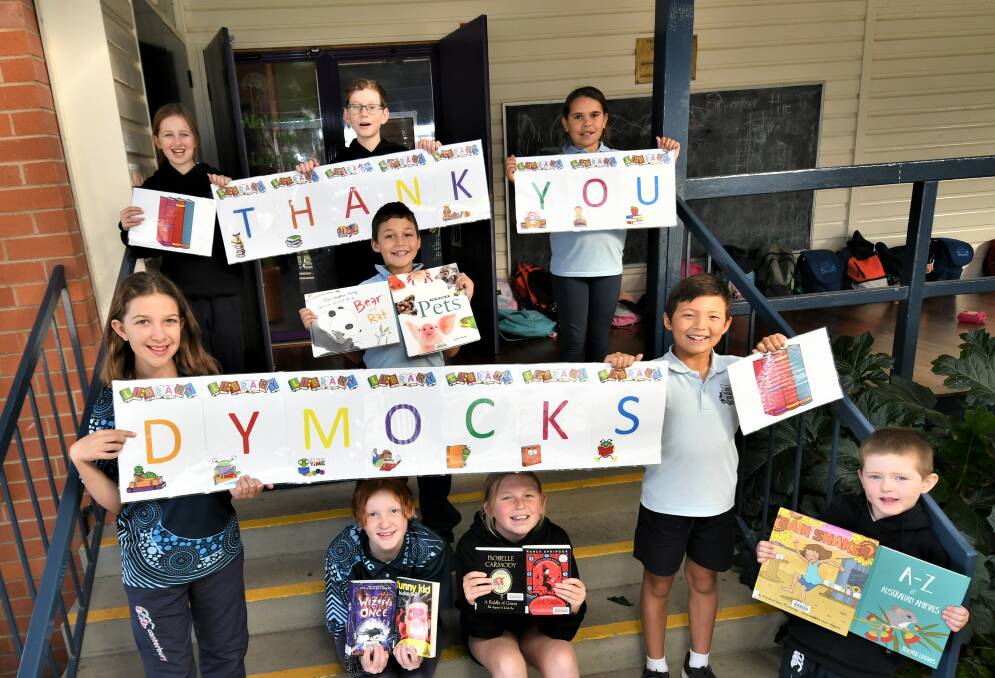 GENEROUS: South Bathurst Public School students thanking Dymocks for their donation of books. Photo: CHRIS SEABROOK 