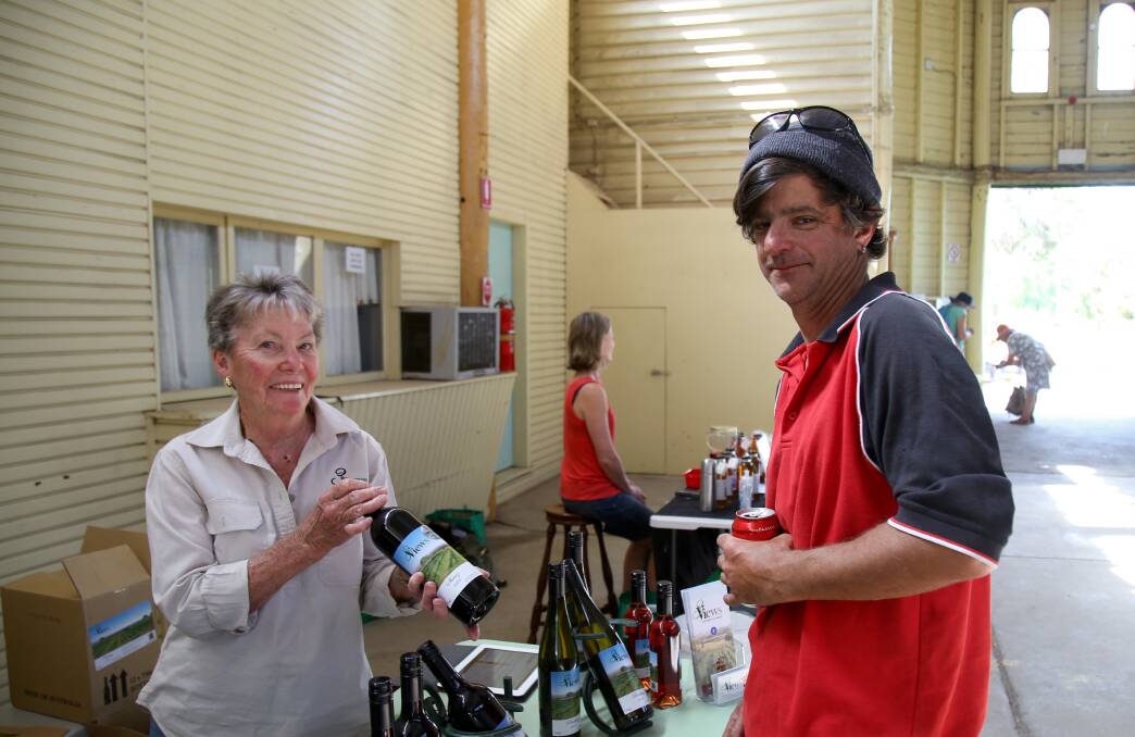TOP DROPS: Ruth Andersen from 3 Views Vineyard with Lloyd Bain at November's Farmers' Market. Photo: PHIL BLATCH