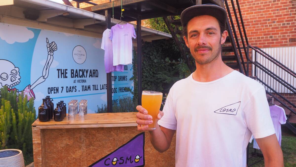 CHEERS: Cosmo Brewing's Ian Carman with a glass of nectarine saison, the brewer's latest release. Photo: SAM BOLT