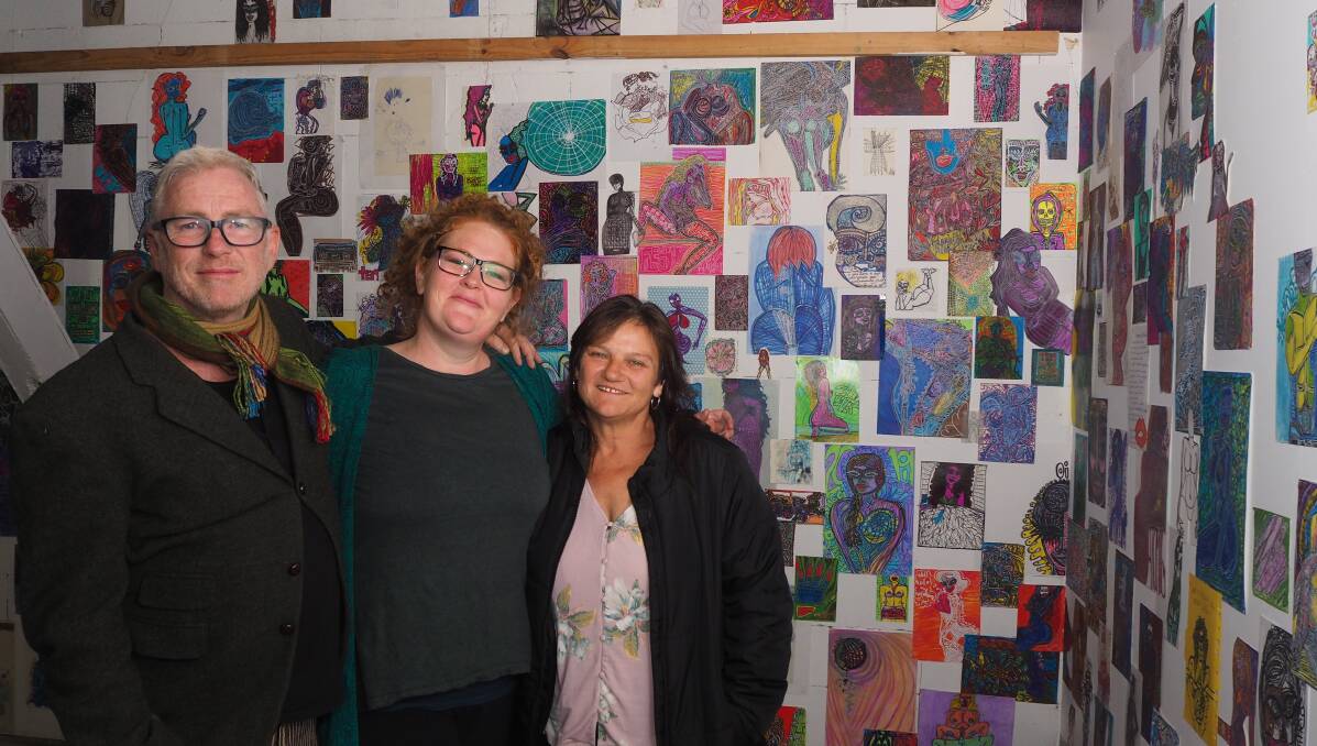 COLOUR THERAPY: 'Overcome' curators Steven Cavanagh and Bridget Thomas with artist Brooke Beale. Photo: SAM BOLT