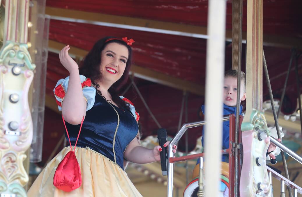 A SMILE AND A SONG: Alex Vidler as Snow White at the Disney Carousel Karaoke event during Children's Day activities at the Bathurst Winter Festival. Photo: PHIL BLATCH 071019pbkaraoke2