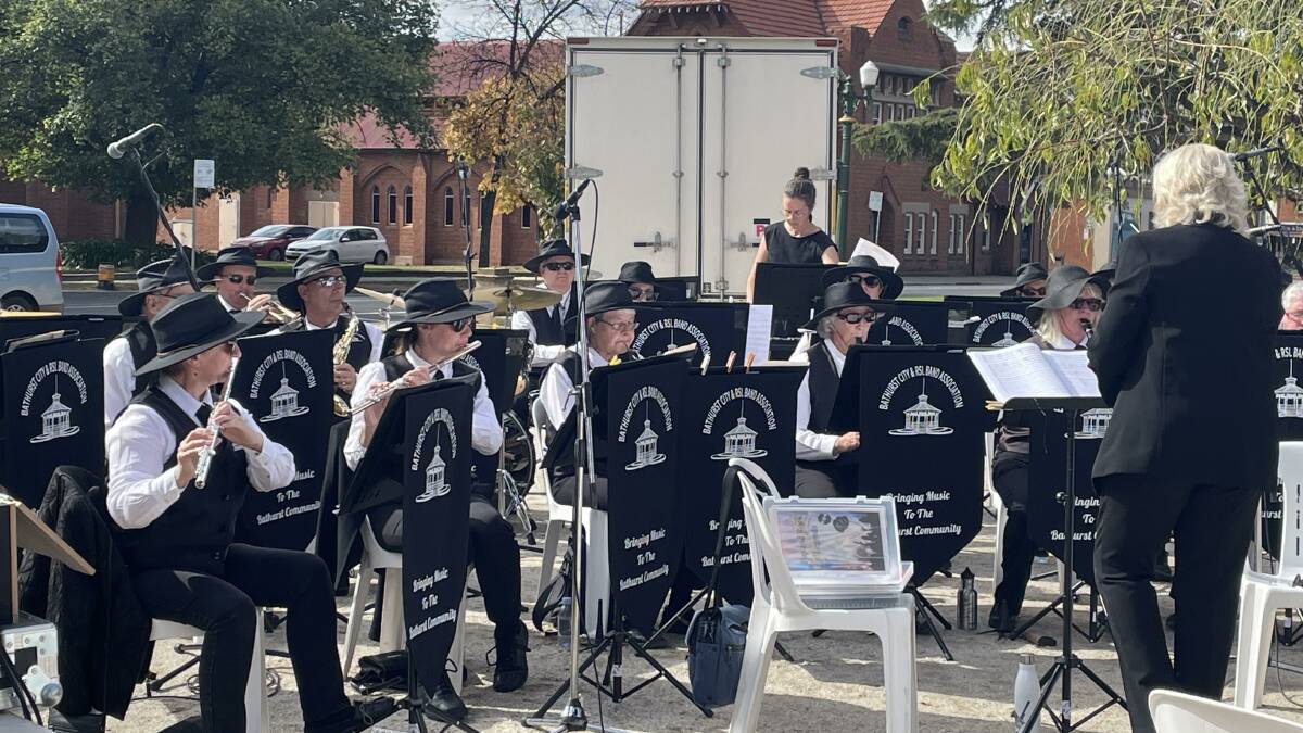 NEW REPERTOIRE: The Bathurst City and RSL Concert Band, conducted by Wendy Jenkins [right], performing on Anzac Day at the Carillon.