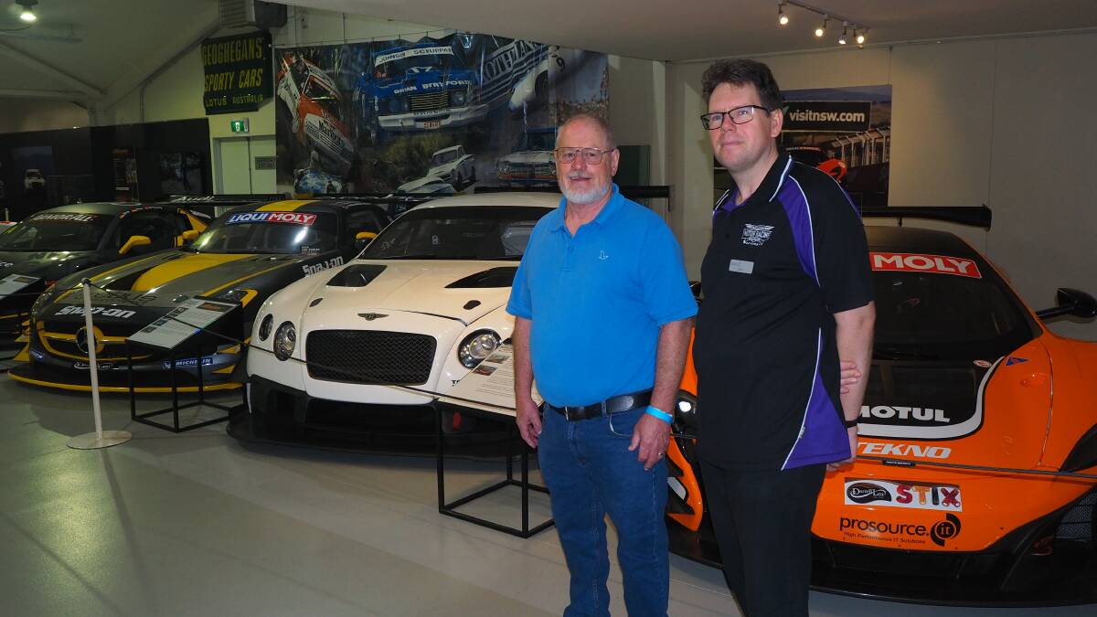 MODERN RACERS: Local motor racing fan Allan Barnes and National Motor Racing Museum tour guide Grant Weatherstone with the Bathurst 12 Hour exhibit.