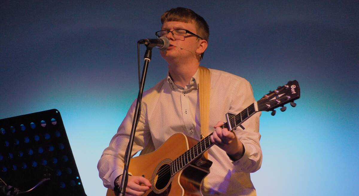 GEEK WITH A GOLDEN VOICE: Bathurst High Campus student Cameron Russell performing at his music showcase on Thursday. Photo: SAM BOLT