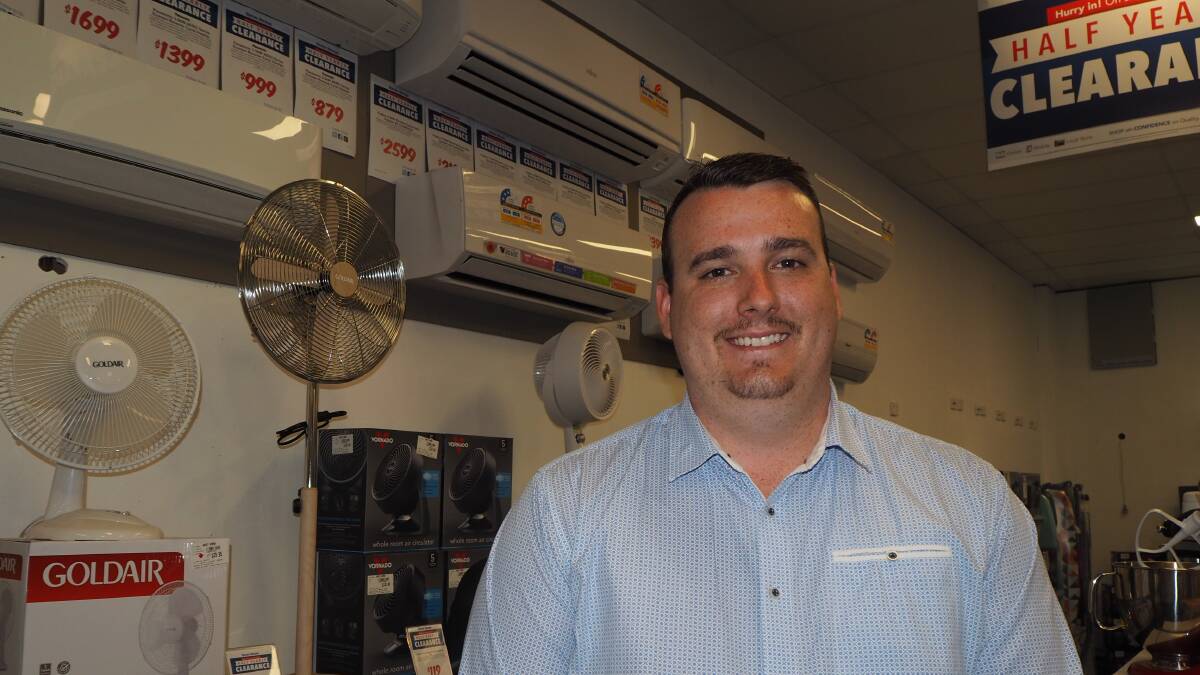 STAYING COOL: Harvey Norman Bathurst electrical proprietor Todd Bray says air conditioner sales have been popular purchases throughout the summer so far. Photo: SAM BOLT 011619sbharv1
