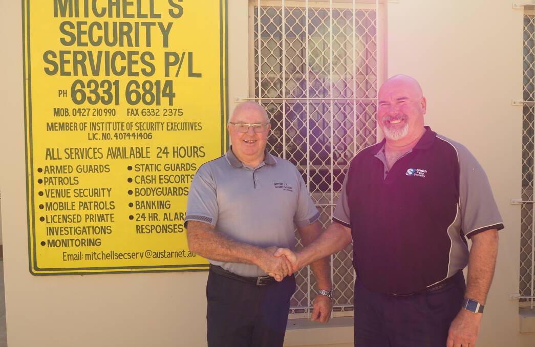 TWO BECOMES ONE: Bathurst Regional Security sales manager Ken Mitchell [formerly of Mitchell Security Services] and managing director Hywel Blake [formerly of Smith and Co Security]. Photo: SAM BOLT
