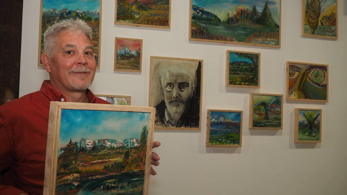 OIL ON CANVAS: Bathurst artist David Pascoe with a series of his works on display at Tremain's Mill. Photo: SAM BOLT
