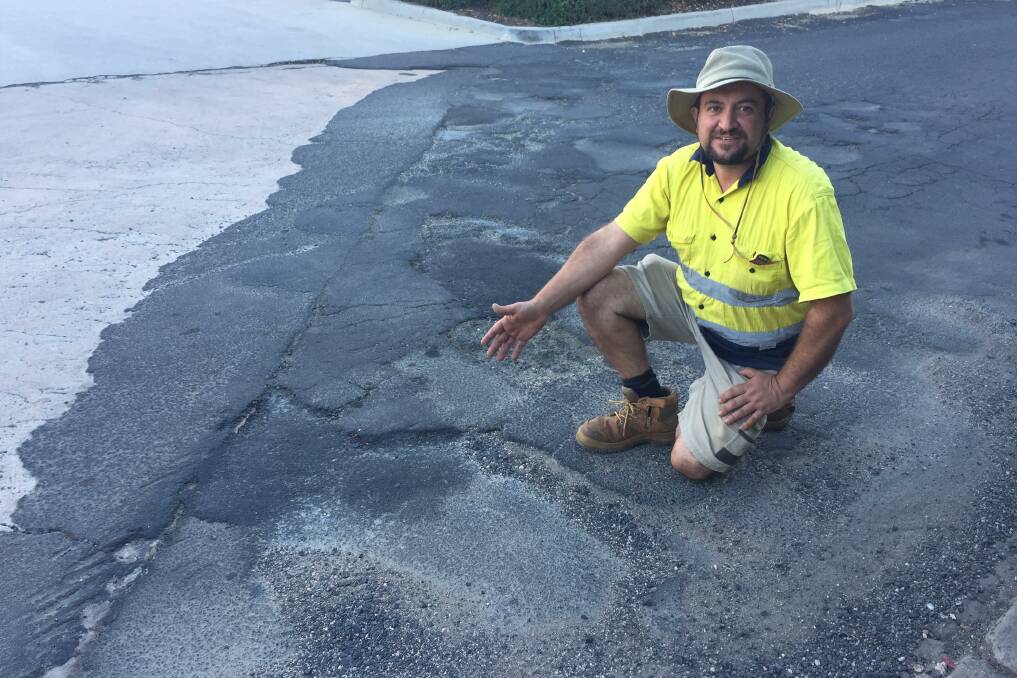 PLEASE EXPLAIN: Local resident Gianni Belmonte has called into question the responsibility of the land owners who let a pothole on Evans Lane [near Hungry Jack's] get out of hand.