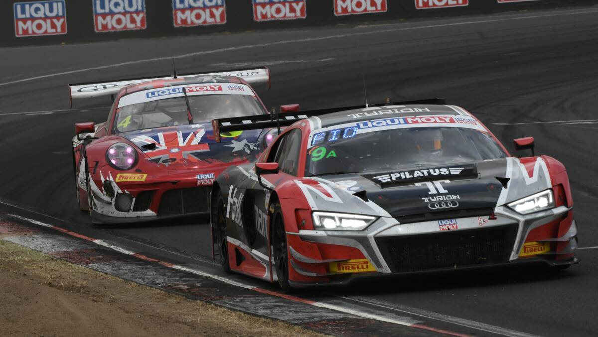 KEEPING THE PACE: The Hallmarc Audi entry of Marc Cini, Dean Fiore and Lee Holdsworth steers ahead of the Grove Racing Porsche of Stephen Grove, Brenton Grove and Benjamin Barker. Photo: CHRIS SEABROOK