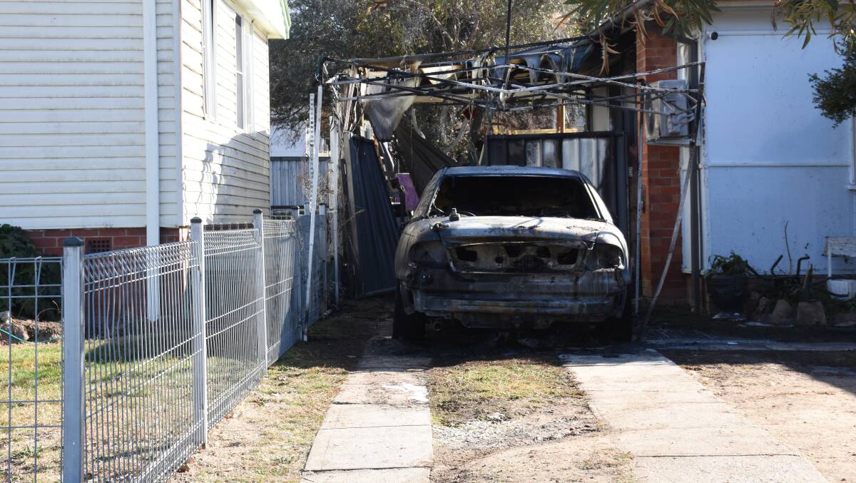 BLAZE: A Holden Commodore parked at a home on Rocket Street was destroyed by an overnight fire. Photo: NADINE MORTON 090319nmfire