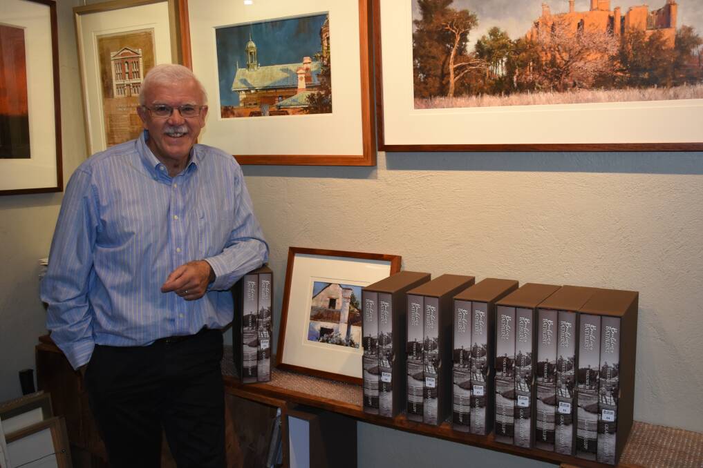 CITY'S HISTORY: Graham Lupp with this newly-released two-volume book 'Building Bathurst 1815-1915'. Photo: NADINE MORTON 030818nmbook