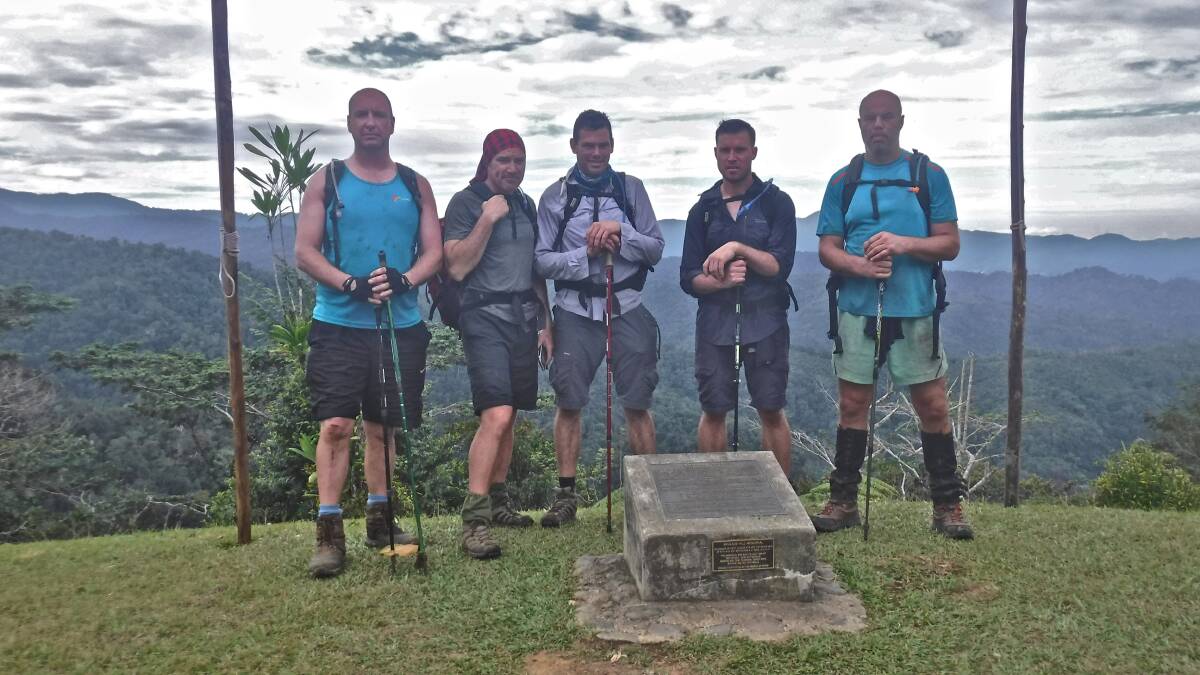 TREK: Steve Ellery, brothers Adam and Marcus Schembri, Ben O'Connor and Dean Mobbs at Brigade Hill during their nine-day trek along the Kokoda Track. Photo: SUPPLIED 110917kokoda2
