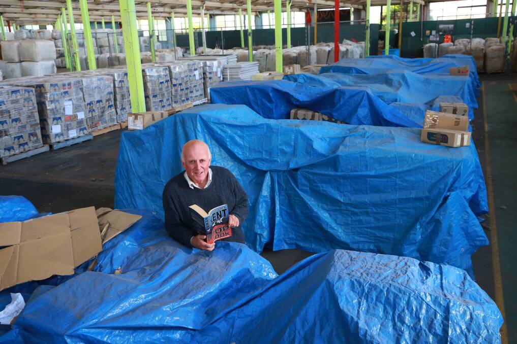 BOOK READY: Lifeline Central West executive director Alex Ferguson with a sea of books that are packed-up for this weekend's book fair at Bathurst Showground. Photo: PHIL BLATCH 051419pbbook2