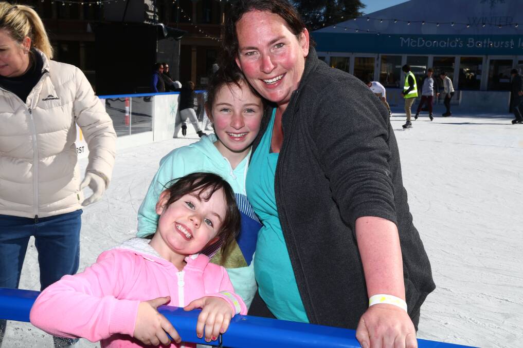 ICE SKATING FUN: Olivia and Sophia Zell and Shiralee Garlinge are among thousands of people who have taken to the ice. Photo: PHIL BLATCH 070217pbskate1
