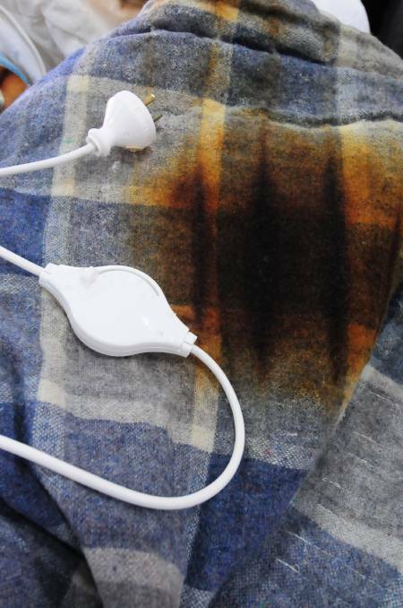 CLOSE CALL: The electric blanket that was found smouldering in a Central West home. Photo: LOUISE DONGES