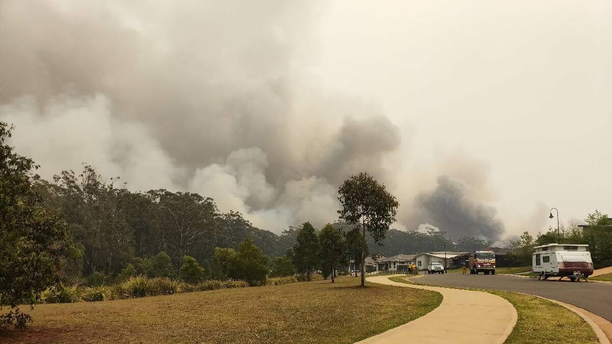 Waiting for the fire front at Port Macquarie. Picture: Laura Marsh