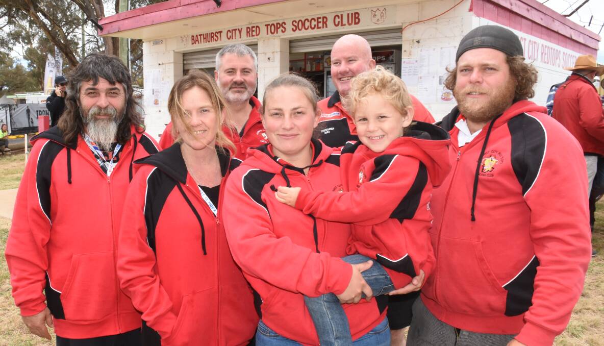 AT A LOSS: Bathurst City Red Tops Soccer Club members (back) Paul Egberts, Darrel Clayton, Grant Foster, (front) Amy Richards, Carol Prosser, Isaac Sutton and Nathan Gay during a previous Bathurst 1000 race. Photo: NADINE MORTON 020218nmred2