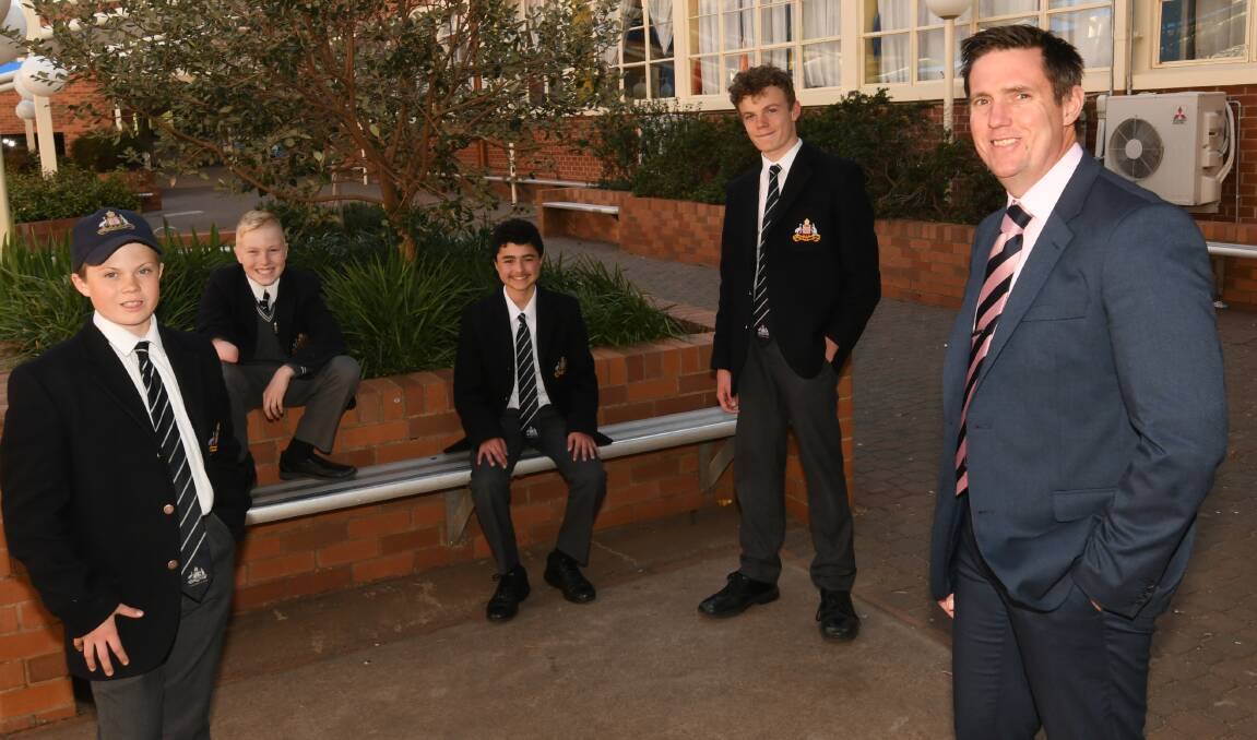 TEAM WORK: St Stanislaus' College head Lindsay Luck says all students, including Jack Garlick, Knox Gibson, Omar Abdalla and Baxter Cook, are asked to look out for each other's mental health. Photo: CHRIS SEABROOK 090220cssc