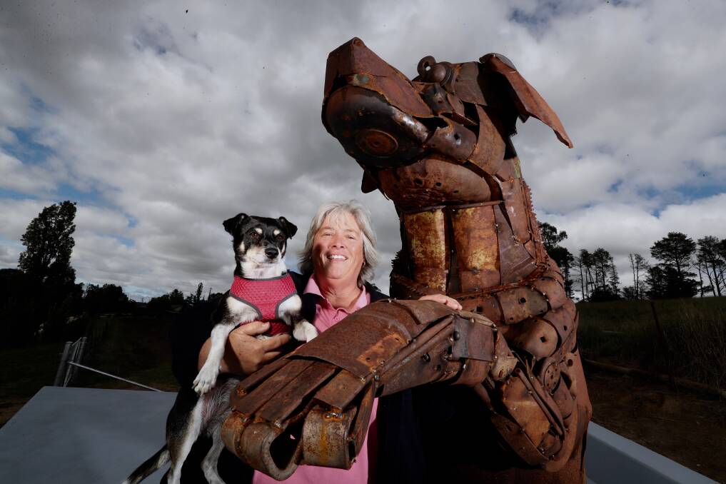 BIG DOG: Sculptor Jane Tyack with her dog Gem and the recently-installed Big Dog sculpture at Dunkeld Park Pet Hotel. Photo: PHIL BLATCH