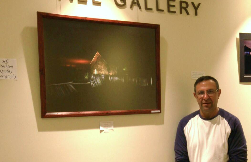 ON SHOW: Bathurst man Jeff Stockton with his photograph 'Where Spirits May Dwell' which is part of an exhibition on show at Lithgow Workies. Photo: SUPPLIED