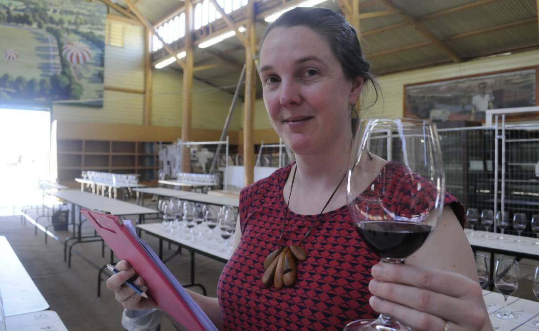 ON THE JOB:  Tasmanian winemaker, and National Cool Climate Wine Show judge, Greer Carland judging the shiraz class. Photo: CHRIS SEABROOK ccwines1a
