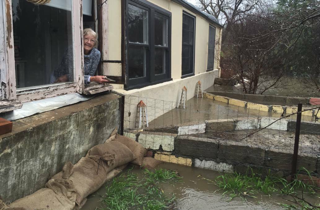 COMMUNITY CONCERN: Her house might have been flooding, but Lorraine Fischbeck’s concern was for her fellow Perthville community members. Photo: NADINE MORTON 072016nmflood32