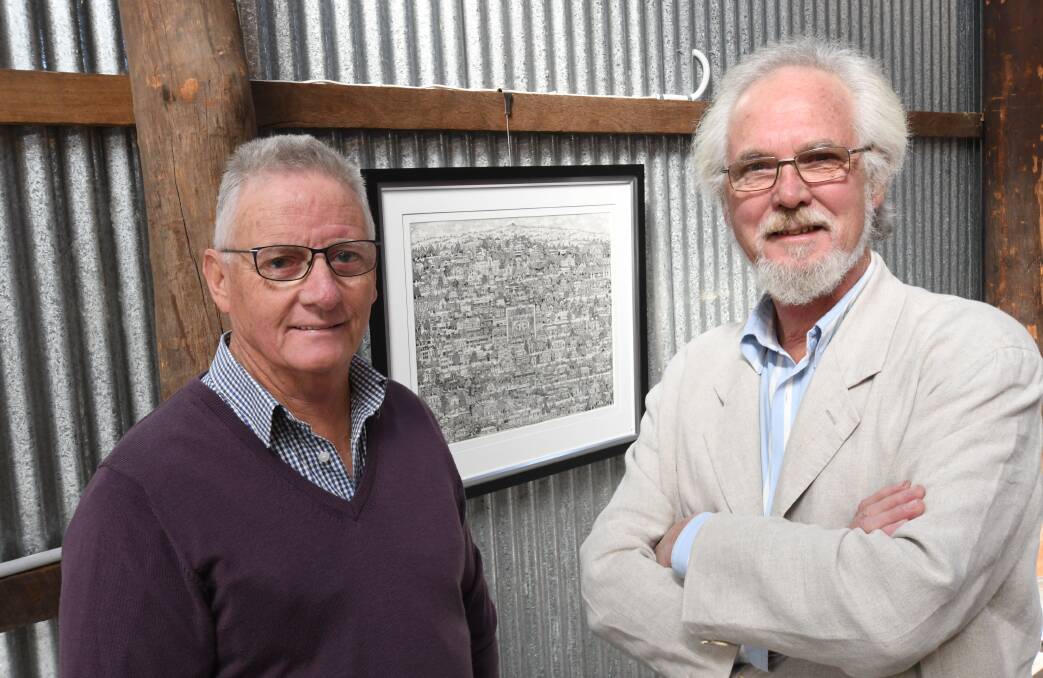 FIRST PLACE: Tremain's Mill owner Stephen Birrell congratulating artist Greg Hyde on his winning entry. Photo: CHRIS SEABROOK 051518cghyde