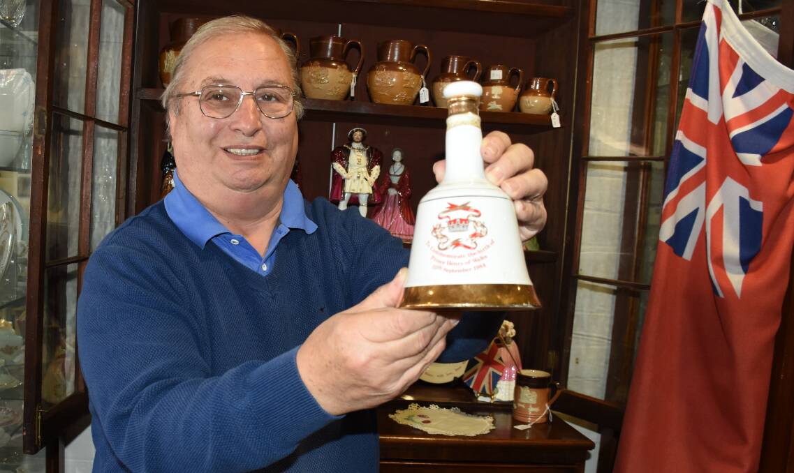 CHEERS: Martin King with a bottle of Bell's Scotch Whisky produced to commemorate the birth of Prince Henry. Photo: NADINE MORTON 051718nmwed