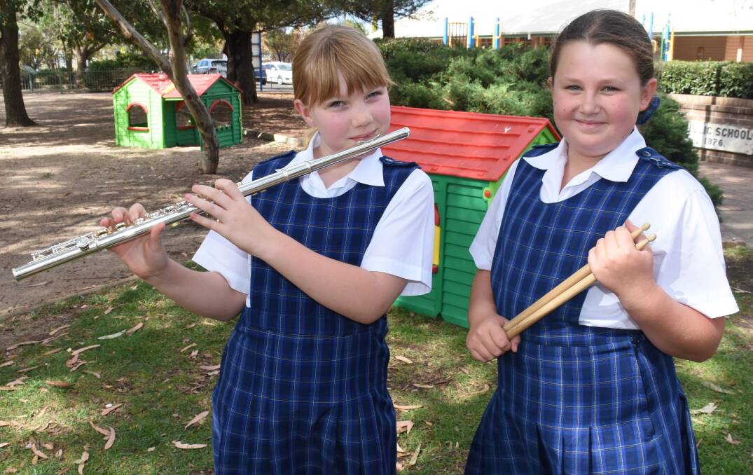 MARCH READY: Eglinton Public School students Amelia Taylor, 10, and Brianna Sufong, 9, will take part in the Combined Schools Marching Band on Anzac Day. Photo: NADINE MORTON 041318nmband