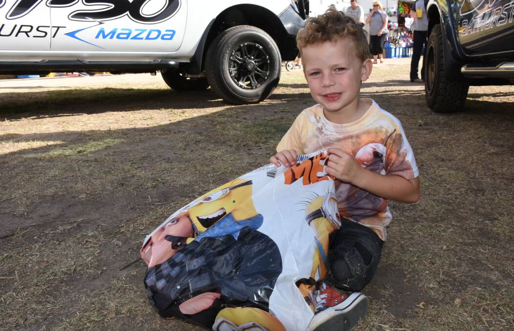 BAGS OF FUN: Harry Jones, 6, from Orange shows off his Despicable Me showbag. Photo: NADINE MORTON 041418nmshow2