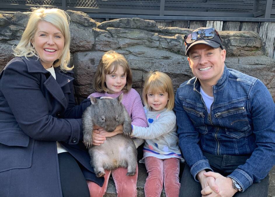 BUNDLES OF JOY: Chezzi and Grant Denyer with their daughters Sailor, 9, and Scout, 4, during a recent visit to the Australian Reptile Park. Photo: SUPPLIED