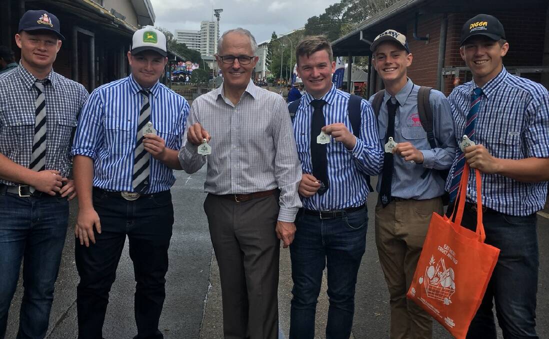AT THE SHOW: St Stanislaus' College agriculture students Camaeron Regan, Austin Miller, Prime Minister Malcolm Turnbull, Harry Begg, Isaac Schembri and Fletcher Wright holding Stannies branded cattle ear tags. 032318stannies