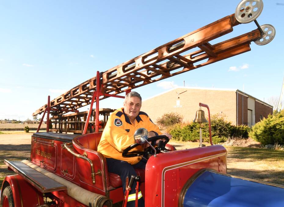 HONOURED: Eglinton Rural Fire Brigade firefighter Greg Ingersole received an Australian Fire Service Medal in the Queen's Birthday Honours. He is pictured in the brigade's 1930 Dennis fire engine. Photo: CHRIS SEABROOK 061118cgreg1